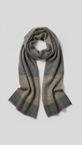 Elegant wool scarf from Motive's collection, centered on a light gray background. The scarf is draped elegantly to...