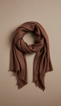 Photograph an elegant cotton scarf in a deep saddle brown, perfectly centered against a neutral, soft tan background. The...